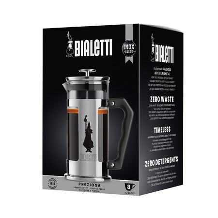 Bialetti Preziosa stempelkande i rustfrit stål vist i original emballage med fokus på italiensk design og kaffebrygning uden filteraffald.
